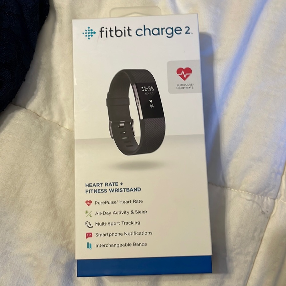 Brand new Fitbit, comes with box, charger, and everything else!